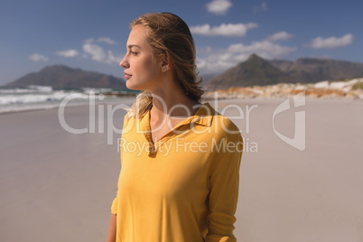 Young woman standing on the beach