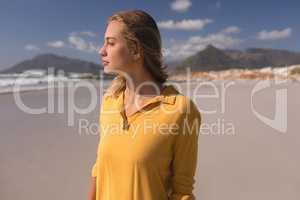 Young woman standing on the beach