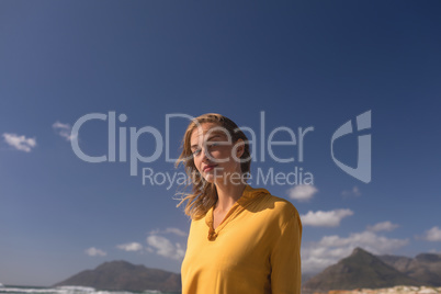 Young woman standing on the beach