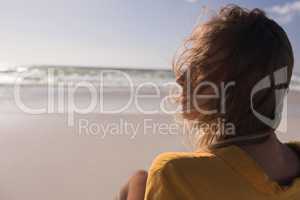 Young woman relaxing at beach on a sunny day