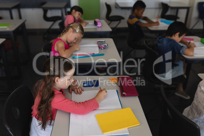 Kids studying in classroom