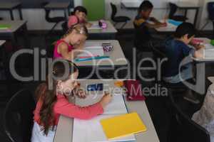 Kids studying in classroom