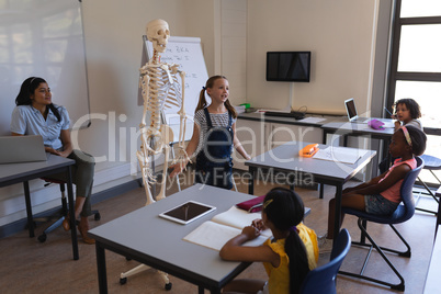 Schoolkids studying in classroom