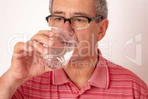 Man drinks water from the glass