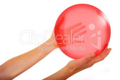 Hands hold glass ball