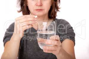 Woman with tablet and water glass