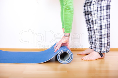 Woman with gymnastics mat