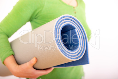 Woman with gymnastics mat