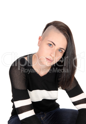 Lovely woman sitting and looking at camera