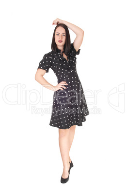 Beautiful woman walking in a pock dot dress