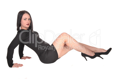 Slim young woman sitting on the floor