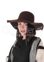 Lovely woman in profile with a brown hat and poncho