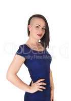 Woman standing in a blue tight dress fancy haircut