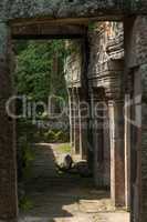 Wall of stone temple framed by arch