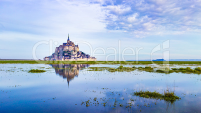 Mont-Saint-Michel reflecting in blue