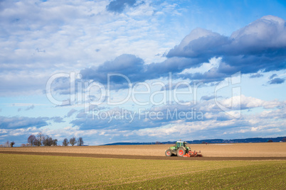 tractor plowing in the spring