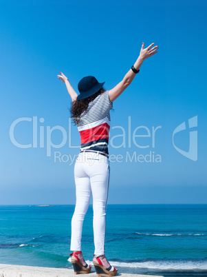 Girl rejoices at sea