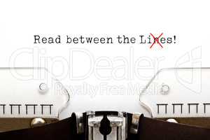 Read Between The Lies Concept On Typewriter