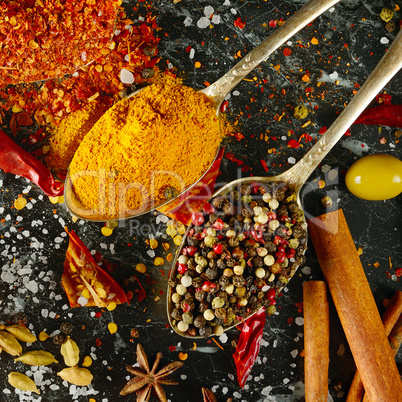 Variety of spices and herbs on kitchen table. Top view.