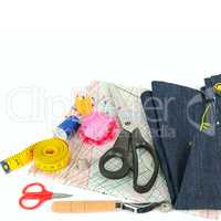 Sewing accessories and paper pattern isolated on white backgroun
