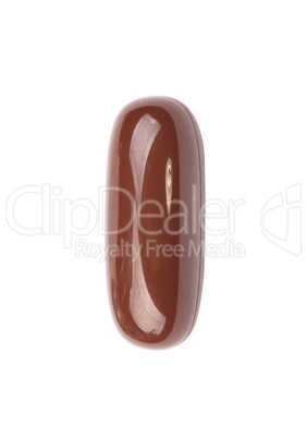 one brown gelatine pill isolated on white backgroung