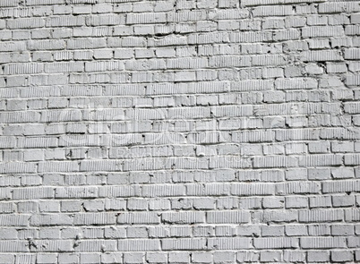 grey brick wall background at day