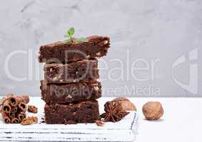 baked square pieces of chocolate brownies with walnuts