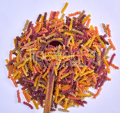 uncooked pasta colorful spiral fusilli made from wheat flour