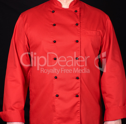 fragment of a red uniform with black buttons on the chef