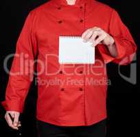 chef in red uniform  holding a blank notebook
