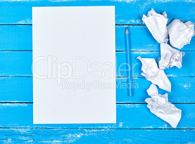 blank white rectangular sheet of paper and crumpled pieces of pa