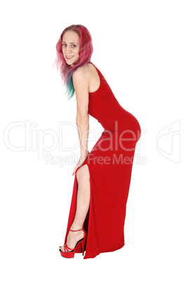 Young woman in red dress and hair bending