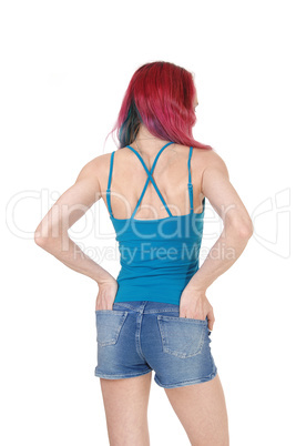 Woman standing from back in shorts