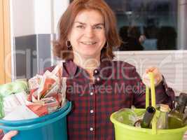 Woman with paper and bottles bucket