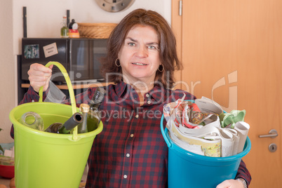 Woman with paper and bottles bucket