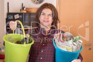 Woman with paper and bottles bucket