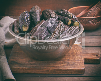 fresh boiled eggplants in an iron bowl