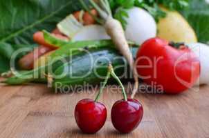 Pair of cherries and a lot of vegetables