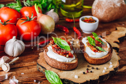 Two Bruschetta with Dried Tomatoes and Spicy Sauce