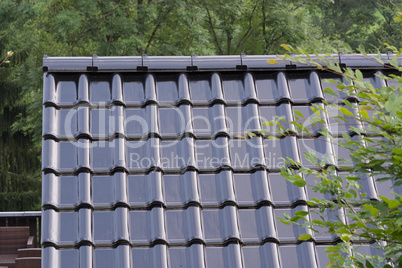 Black roof tiles on a roof