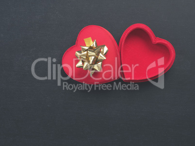 Heart shaped gift box with a golden bow