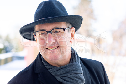 Portrait of a senior with hat