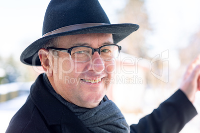 Finger pointing of man with hat