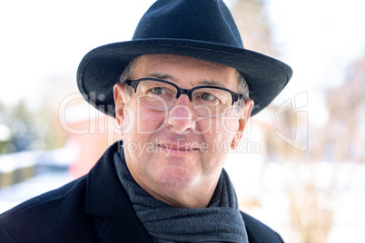 Portrait of a senior with hat