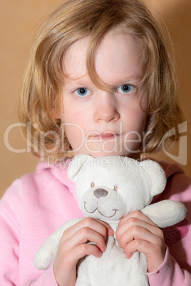 Child with plush toy