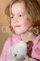 Child with plush toy