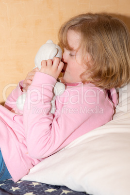 Child with plush toy