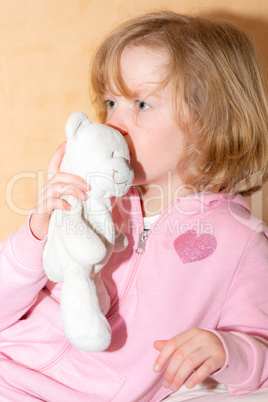 Child with plush toy