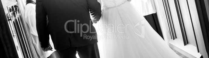 Panorama of bride and groom, in black and white