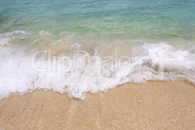 Tropical beach background with soft wave and sand